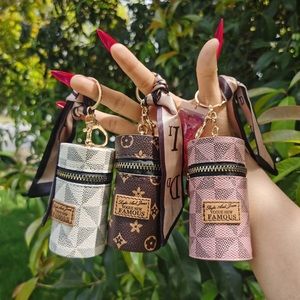 Set of three! Shine on! Lip gloss keychain/purse charm. White, Pink & Brown.